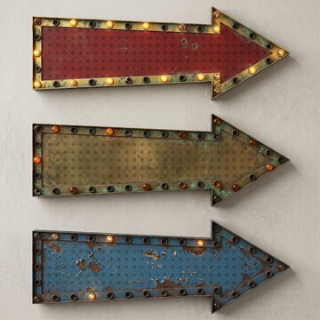Vintage light up marquee arrow signs set isolated on neutral background