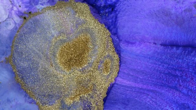 Mixing different colored alcohol inks and epoxy resin in a close-up view