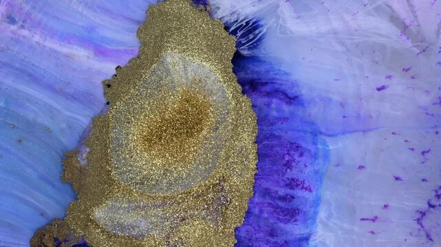 Mixing different colored alcohol inks and epoxy resin in a close-up view