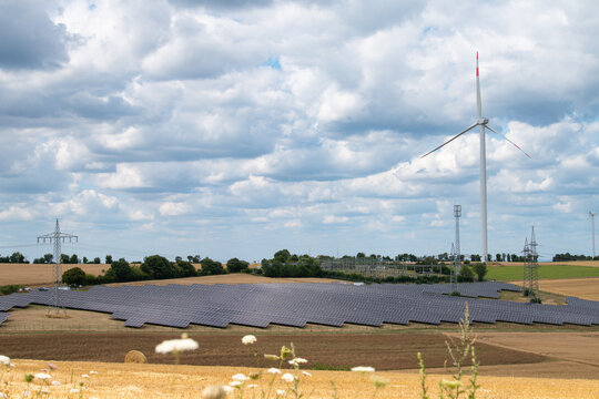 Solar panel station, wind turbine park, agriculture field with windmills, renewable sustainable energy, electricity technology, environment conversation, Germany