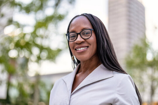 Portrait of a happy businesswoman smiling in the city
