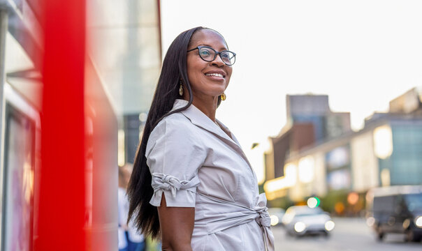 Portrait of a happy businesswoman smiling in the city
