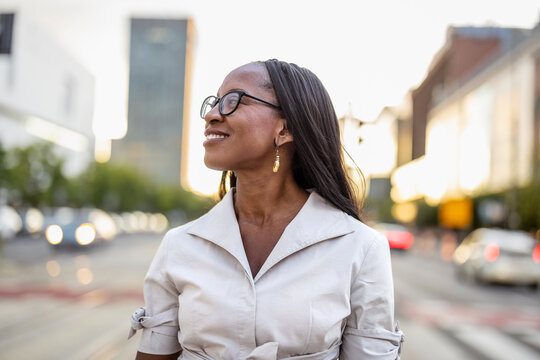 Portrait of a happy businesswoman smiling in the city
