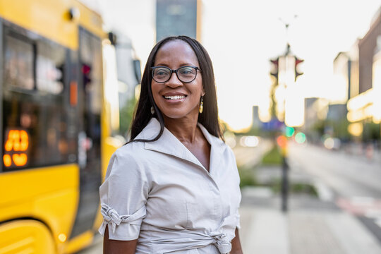 Portrait of a happy businesswoman smiling in the city
