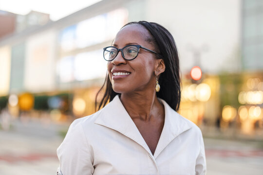 Portrait of a happy businesswoman smiling in the city
