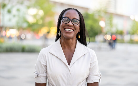 Portrait of a happy businesswoman smiling in the city
