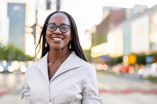 Portrait of a happy businesswoman smiling in the city
