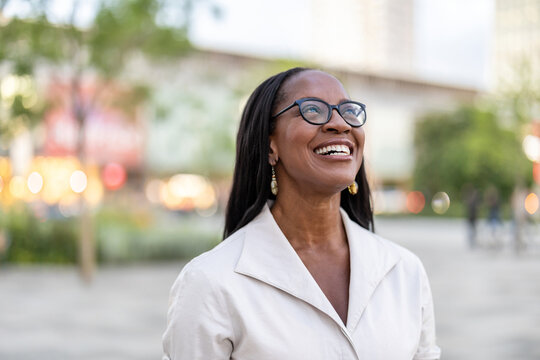 Portrait of a happy businesswoman smiling in the city
