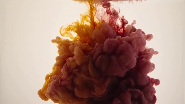 Amber and Plum Pigment Clouds Bloom Slowly Through Clear Water