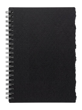 Torn notebook paper sheet on metal spiral binding, black textured paper, stationery item isolated on transparent background