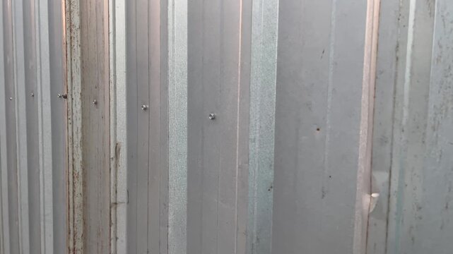 Symmetric vertical pattern of modern galvalume wall cladding
