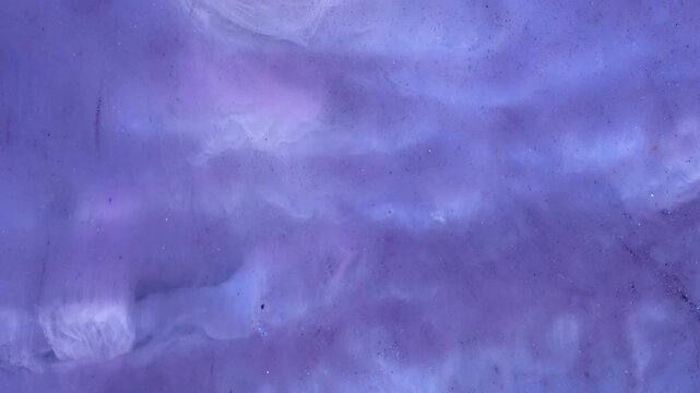 Mixing alcohol inks with epoxy resin in various colors for close-up view