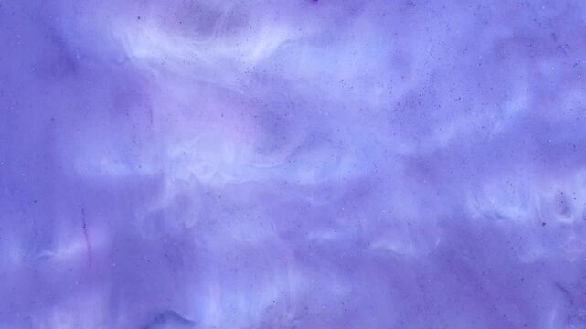 Mixing alcohol inks and epoxy resin with different colors in close-up view