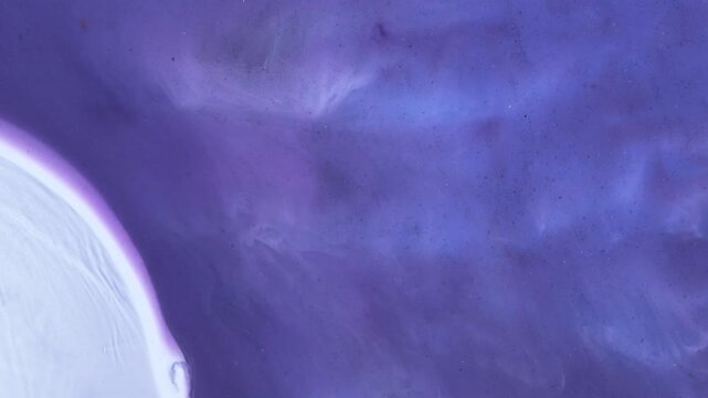 Mixing different colored alcohol inks and epoxy resin in close-up view