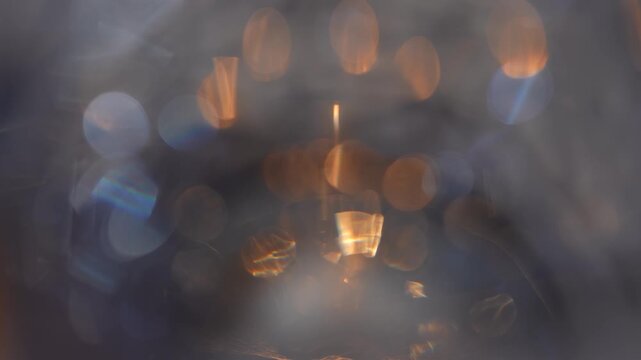 Blurred, defocused background with golden and blue refractions and glowing bokeh. Concept optical abstraction for design, overlay, ads, websites, banners, magazines and presentations.