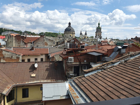 Panoramic view of the roofs of old Lviv, Ukraine. Red tiles, ancient architecture, domes of churches