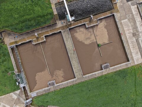 Aerial view wastewater treatment plant settling tanks