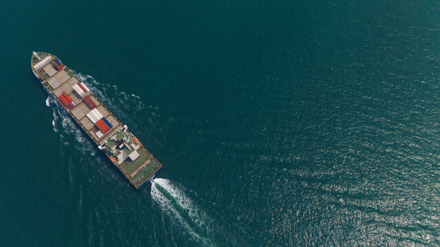 Aerial view from a container drone. Container ships in export-import and logistics business Transporting goods to large ports Worldwide shipping and logistics business International business abroad
