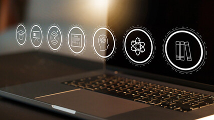 E learning tools on laptop screen with various educational icons and symbols