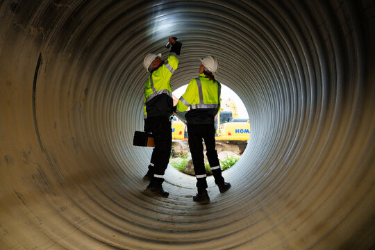 Industrial engineers who inspect large utility pipes inside or in tunnels used for water systems.