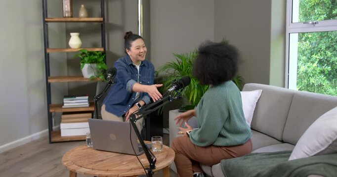 Chinese host denim African guest sweater after chat shaking near mics to greet and resume podcast
