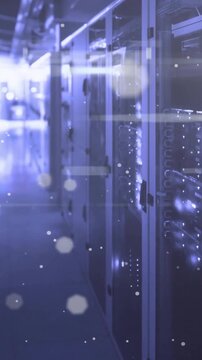 Animation of light spots floating over computer servers