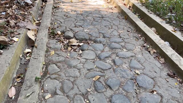 Old Cobblestone Road and Concrete Border Walkway
