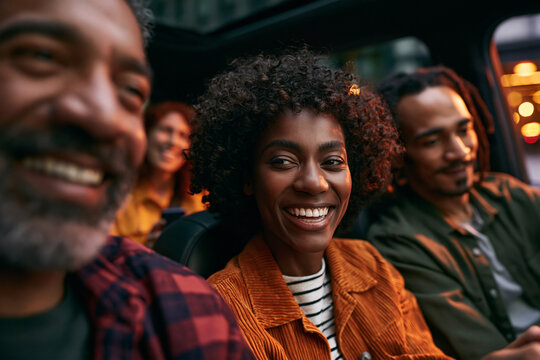 Diverse Happy Friends Smiling Together in Car at Night
