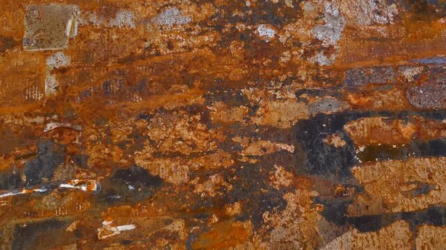 A rusty metal surface. A rusted metal surface; metal damaged by corrosion.