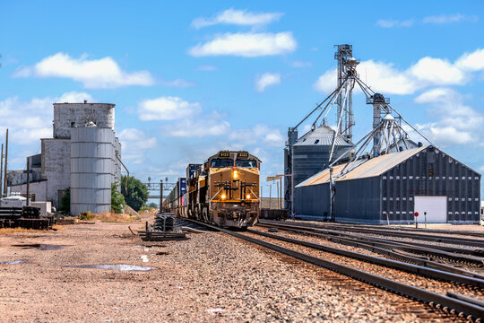 Train moving through industrial aggregate plant