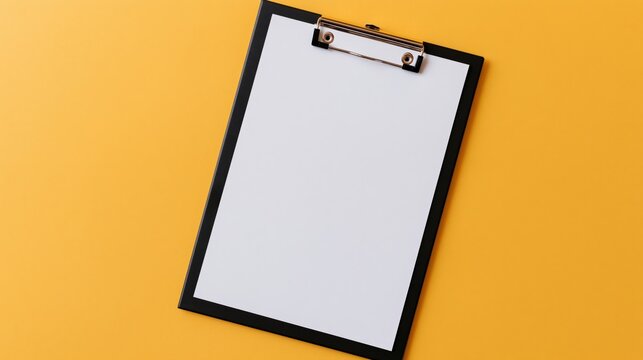 A blank clipboard rests on a bright yellow background.