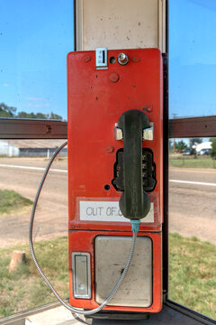 Old telephone booth on a corner of an abandoned town