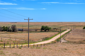 Obraz premium Remote country road within the great plains