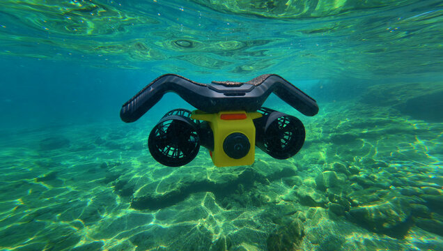 Underwater photo of latest technology water scooter used for scuba diving and snorkeling  featuring motor propulsion
