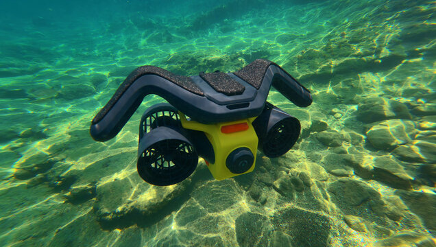 Underwater photo of latest technology water scooter used for scuba diving and snorkeling  featuring motor propulsion