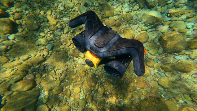 Underwater photo of latest technology water scooter used for scuba diving and snorkeling  featuring motor propulsion