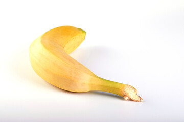 Single banana against white background. Flat lay, top view © Marina Dubin
