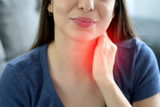 Unrecognizable Young Woman with Stiff Neck and Red Highlight Showing Pain Area