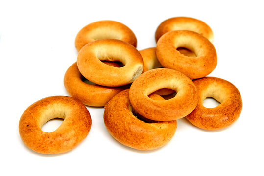 Stack of a golden brown bagels in a variety of flavors. Everything Bagels Isolated on White background