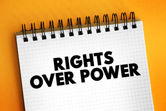 RIGHTS OVER POWER text on a notepad sheet. Concept photo about fighting corruption, democracy values, human freedom, social activism, anti authoritarianism and citizens choices.