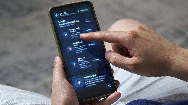 User reviews personalized wellness recommendations on a smartphone, completing daily goals for hydration, movement and stress relief in a digital coaching routine.
