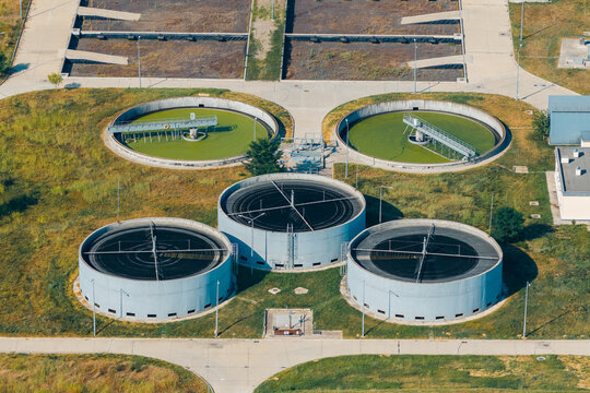 Aerial view of the Telavi Waste Water Treatment Facility with large circular sedimentation tanks and industrial infrastructure in Kondoli, Kakheti, Georgia.