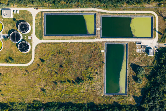 Aerial view of the Telavi Waste Water Treatment Facility featuring large circular sedimentation tanks and rectangular treatment ponds in Kondoli, Kakheti, Georgia.
