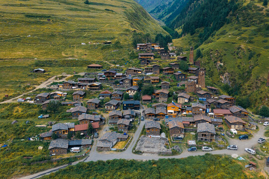 Aerial view of Dartlo village, a historic settlement in the Caucasus Mountains featuring traditional stone houses and defensive towers nestled in a green valley in Dartlo, Kakheti, Georgia.