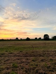 Fototapeta premium Fantastic orange sunset in the coutryside, natural orange sky, beautiful twilights