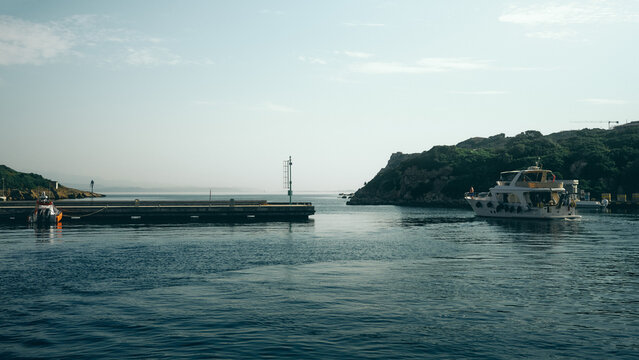 Tourist boat leaving port in Sardinia
