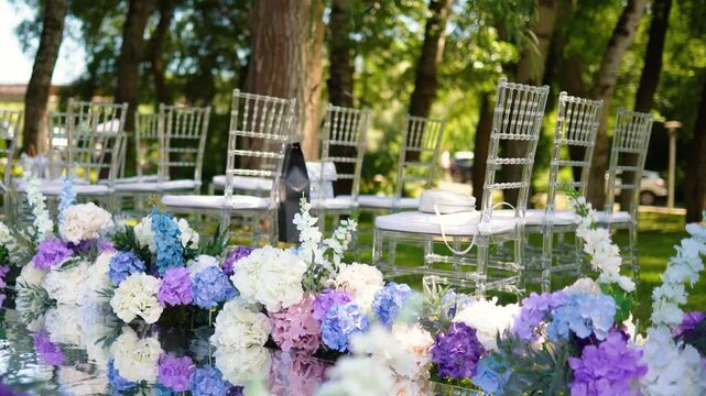 wedding arch of white rose flowers in the forest before the wedding ceremony of the bride and groom, festive romantic boho style decor