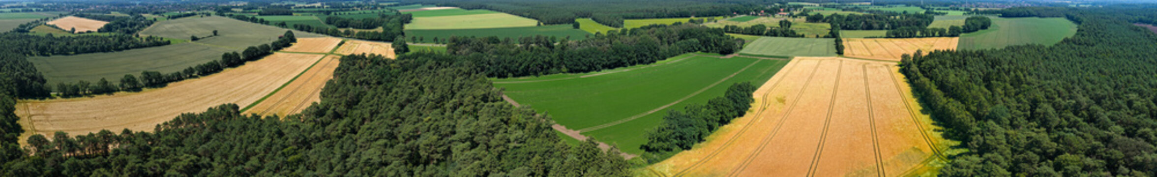 Panoramic agricultural land and natural landscape. Panoramic aerial field. Aerial geometric field panorama. Farming landscape panorama. Aerial rural countryside landscape with farmland field