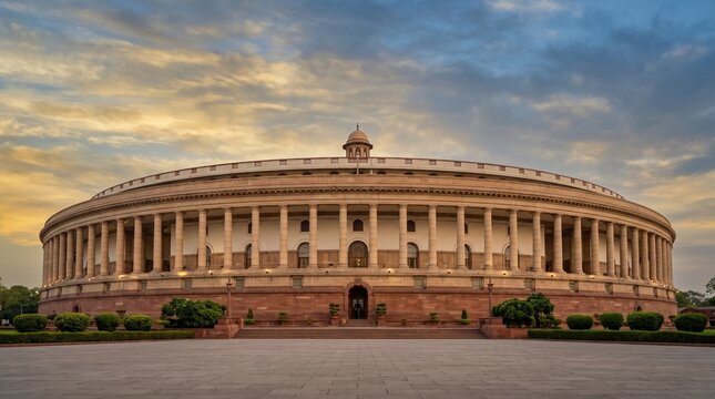 Parliament House New Delhi India beneath dramatic golden sunset sky with iconic historic architecture