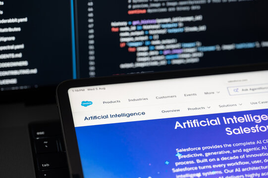Salesforce Ai company web page on program code background